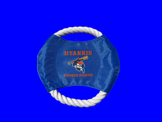 Blue frisbee with white rope handle and 'Hyannis Harbor Hawks' logo on a wooden surface